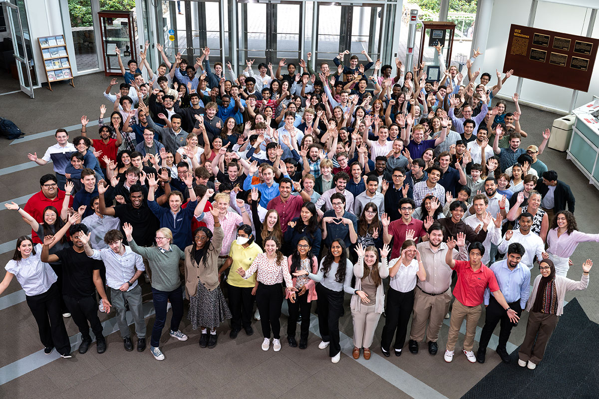 200 students gather in the lobby of Lincoln Laboratory to celebrate the beginning of their summer-long internship at Lincoln Laboratory.