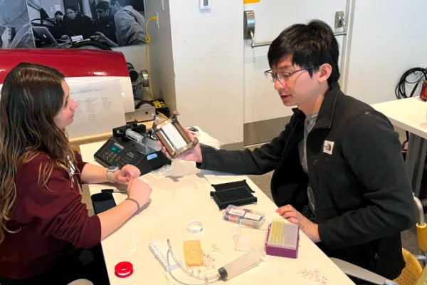 At Beaver Works Center, MIT students work on the droplet-dispensing manifold, a project which focused on developing simple high-throughput tools with integrated environmental control systems.